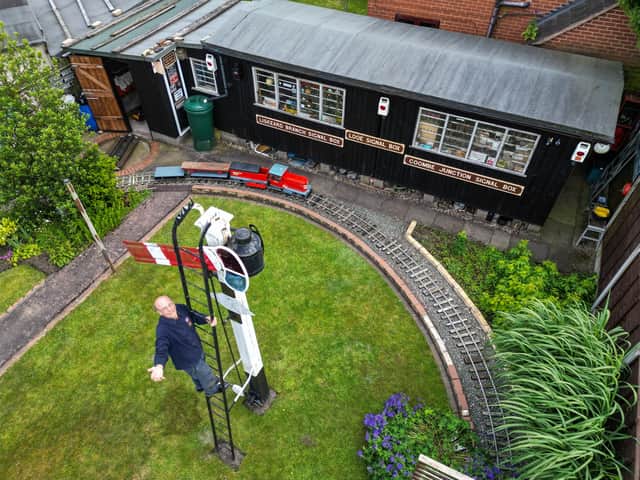Derek Burwell, 83, spends 30 years building miniature railway in garden.