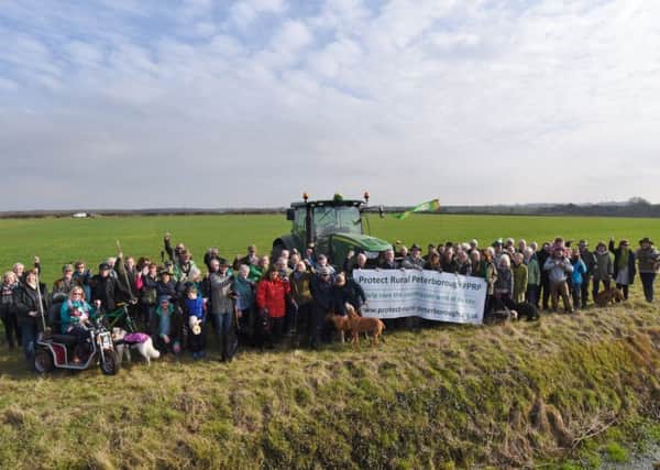 Castor, Ailsworth and Upton residents gather at the proposed development site 200ms from Castor Hanglands EMN-170215-161941009
